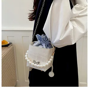White box shoulder bag with pearl handle and denim inner pouch, stylish detail crossbody bag