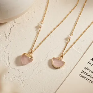 Natural rose quartz pendant necklace featuring delicate gold chain and pearl accents for women detail view.