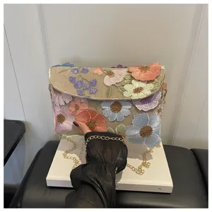 Floral embroidered shoulder bag with gold chain strap, stylish womens messenger bag.