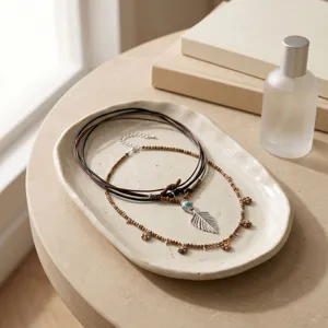 Bohemian layered wooden bead leather cord necklace with feather pendant detail shot