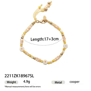 Summer beach style beaded bracelet for women with yellow beads and cute daisy flowers.