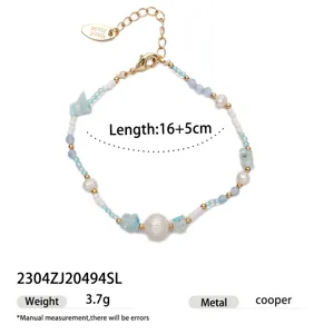 Detail view of the summer beach beaded bracelet with pearls and glass stones, showing length.