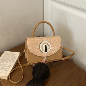 Stylish patent leather crossbody shoulder bag for women, featuring chic flap and circular clasp.