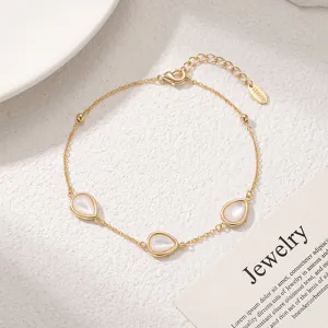 Delicate gold chain bracelet featuring three elegant teardrop mother of pearl charms for daily wear.