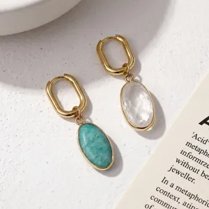 Natural stone drop earrings featuring gold-plated geometric hoops and crystal quartz pendants.