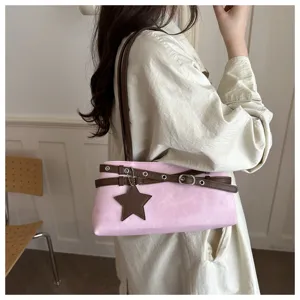Stylish pink shoulder bag for women with brown straps and cute star pendant detail.
