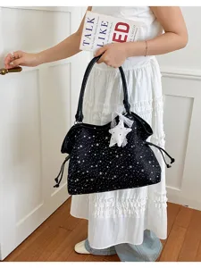 Detailed view of the stylish star-studded black tote bag with cute star pendant for daily use.