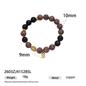 Natural stone obsidian beaded bracelet detail view showing 9mm and 10mm beads with copper pendant.