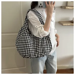 Black and white gingham shoulder bag detail, casual soft hobo handbag for daily use.