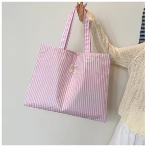 Rosa gestreifte Canvas Tote Bag, lässige große Schultertasche für Damen im Alltag.