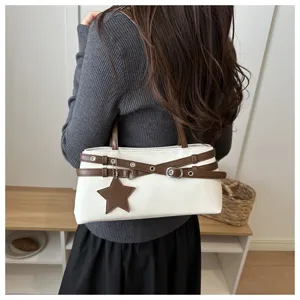 Minimalist casual shoulder bag for women, stylish white and brown design with star pendant.