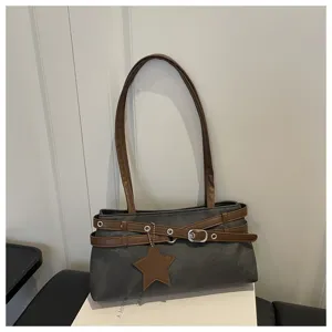 Detailed view of a trendy Korean style casual grey shoulder bag with brown straps and star pendant.
