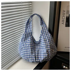 Detailed view of the Korean vintage blue and white plaid shoulder bag, large capacity design.