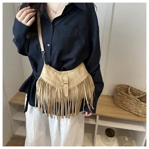 Brown suede fringe crossbody bag detail, vintage bohemian style shoulder bag showcase.