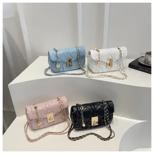 Quilted chain shoulder bag for women, stylish crossbody handbag with metal lock closure.