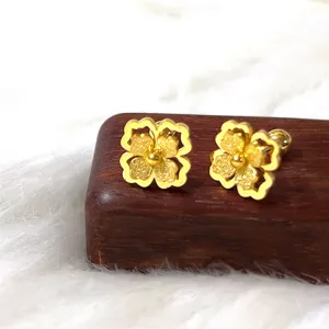 Exquisite gold frosted four leaf clover stud earrings detailed close up fashion jewelry accessory