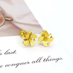 Gold frosted pinwheel flower stud earrings, elegant and fashionable women jewelry accessory.