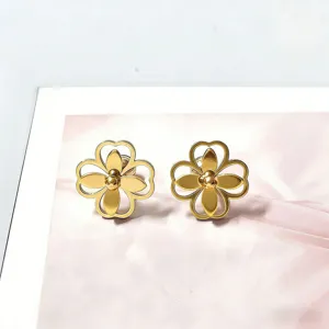 Gold clover flower stud earrings, elegant detail view of fashion metallic women jewelry.