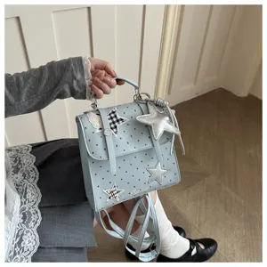 Cute college style polka dot backpack with star patches, versatile handle and straps for women.