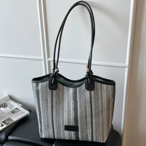Casual striped straw woven tote bag for women, large capacity beach shoulder bag style.
