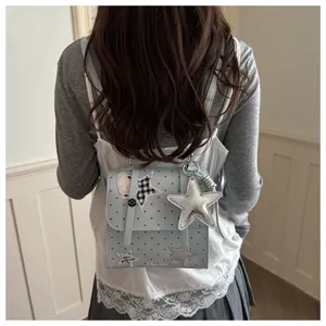 Sweet college style light blue polka dot backpack with cute star charms for daily wear.
