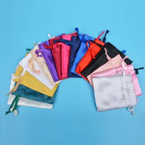 Detailed view of colorful satin drawstring pouches in a fan-shaped arrangement.