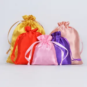 Close-up of premium satin drawstring pouches showing fabric texture and vibrant colors