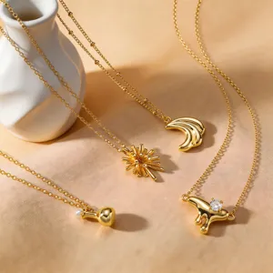 Gold-plated minimalist necklace set featuring unique crescent moon and geometric pendants.