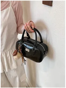 Stylish black patent leather bowling bag, versatile Boston shoulder handbag for women daily wear.
