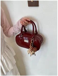 Dark red patent PU leather Boston handbag with cute bear pendant, stylish casual shoulder bag.