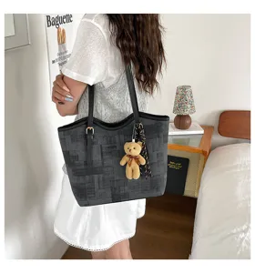 Large capacity casual dark pattern tote bag with cute bear pendant and shoulder straps.