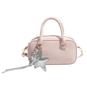 Chic pink bowling handbag for women, stylish PU leather pillow shoulder bag with silver star charm.