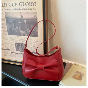 Red underarm shoulder bag for women, featuring a chic front bow design, stylish and trendy.
