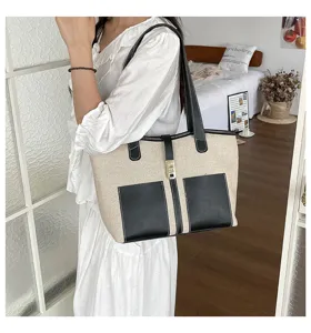 Canvas contrast color tote bag for women, stylish large capacity single shoulder commuter handbag.
