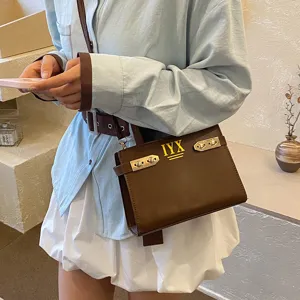 Trendy brown structured shoulder bag with metal lock and custom logo, stylish daily purse.