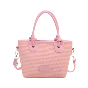 Pink woven bucket bag beach handbag stylish knot crossbody bag for women summer fashion.