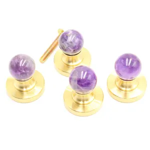 Amethyst cabinet knob detail shot, natural stone ball with brass base hardware for furniture.