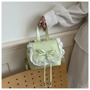 Zaino mini floreale carino con bordo in pizzo bianco e fiocco per viaggio e uso quotidiano.
