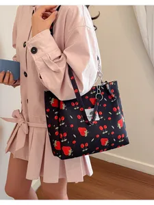 Cute black canvas tote bag for women with red strawberry cherry print casual shoulder bag.
