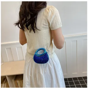 Detail view of blue glitter acrylic crescent mini evening bag with chic gold chain strap.