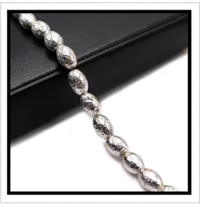 Silver electroplated lava stone barrel beads detail, perfect for DIY jewelry and bracelets.