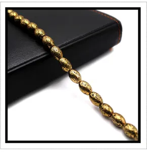 Gold electroplated volcanic stone barrel beads detail, ideal for DIY bracelet jewelry.