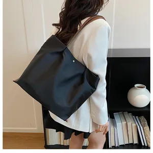 Casual minimalist nylon tote bag for women, lightweight daily shoulder commuting bag detail.