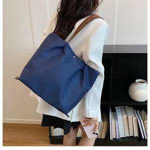 Casual minimalist commuter nylon tote shoulder bag, stylish lightweight daily accessory for women.
