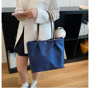 Casual nylon tote bag for women, lightweight commuting shoulder bag with brown handles.