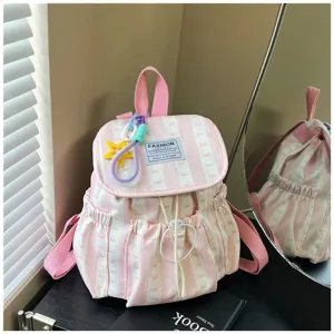 Pink striped backpack detail, sweet bow pattern, large capacity student school bag style.