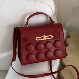 Red stylish top handle shoulder bag with unique 3d round buttons and metal lock for women daily