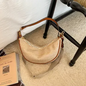 Sac bandoulière en paille tissée pour femme, sac hobo décontracté et élégant avec bordure en cuir.