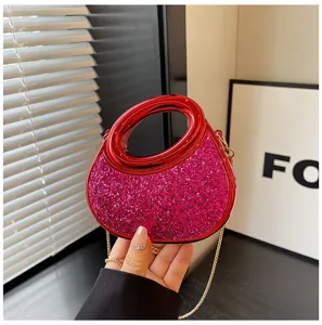 Acrylic crescent evening bag with glitter pink body and red handle, stylish mini handbag.