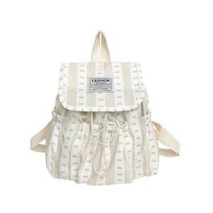 Casual striped canvas backpack with cute bow patterns for student daily use and outdoor travel.